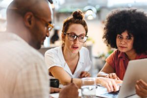 Image: Three people discussing 